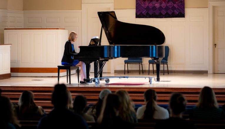 Student performing piano recital