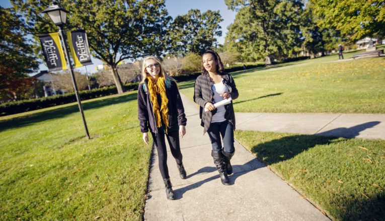 Students walking outside on campus