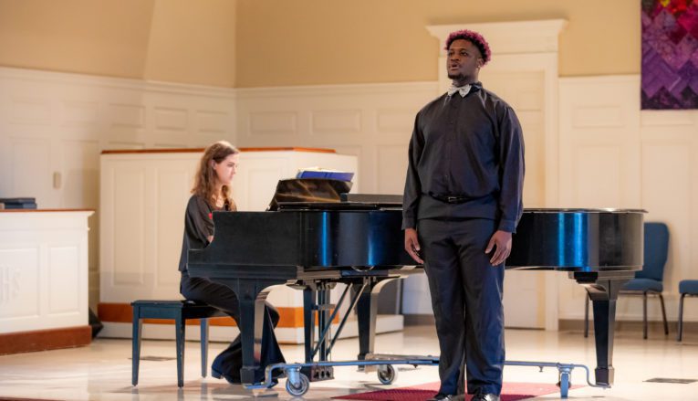 Student giving voice recital