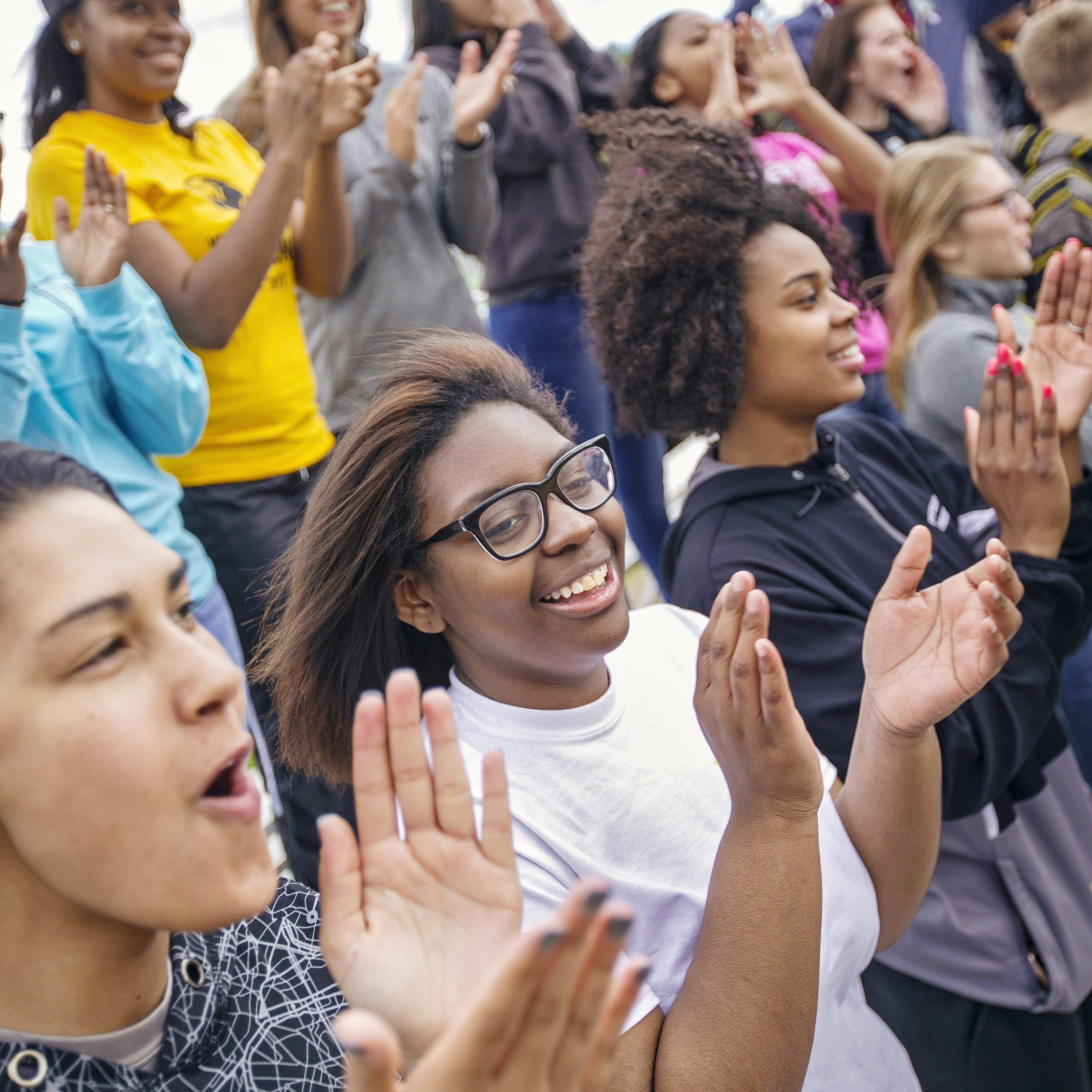 Group of students cheering at athletic event