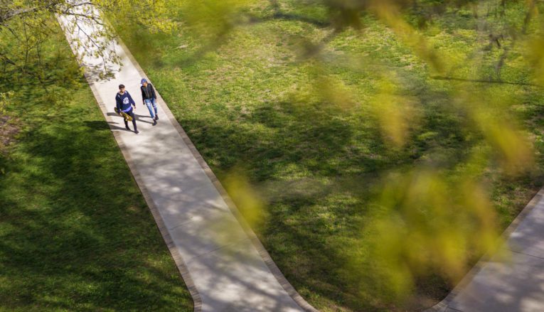 Aerial view of students walking on campus